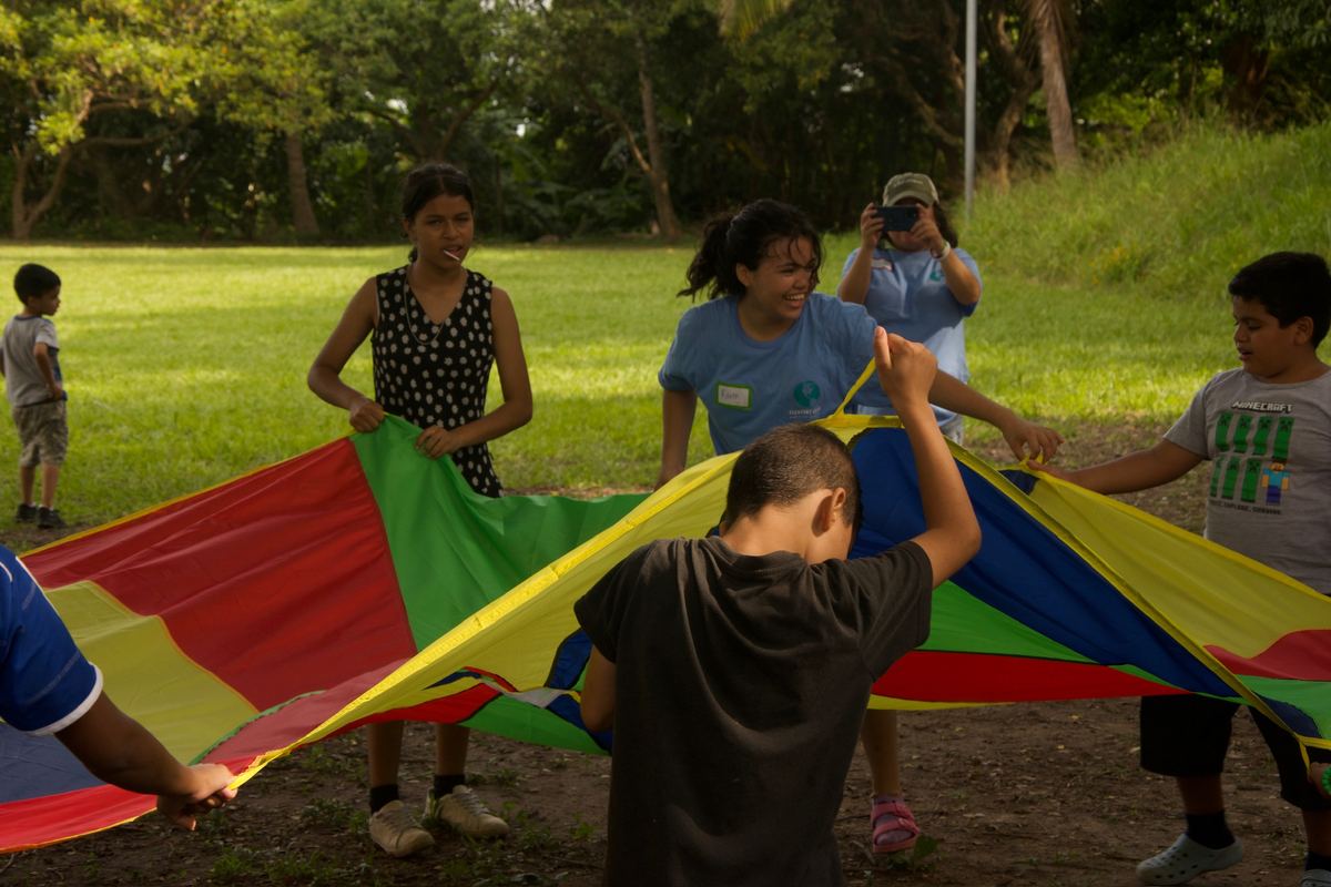 Children's ministry parachute game in El Salvador